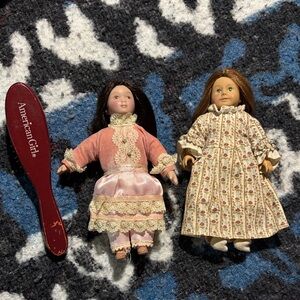 American Girl Dolls with Red Brush and Pink Outfits
